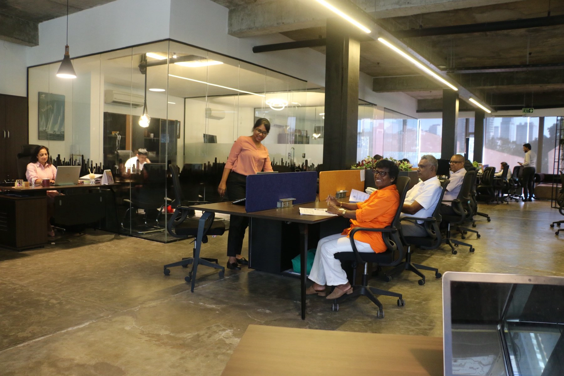 Mediquipment team working at collaborative workstations